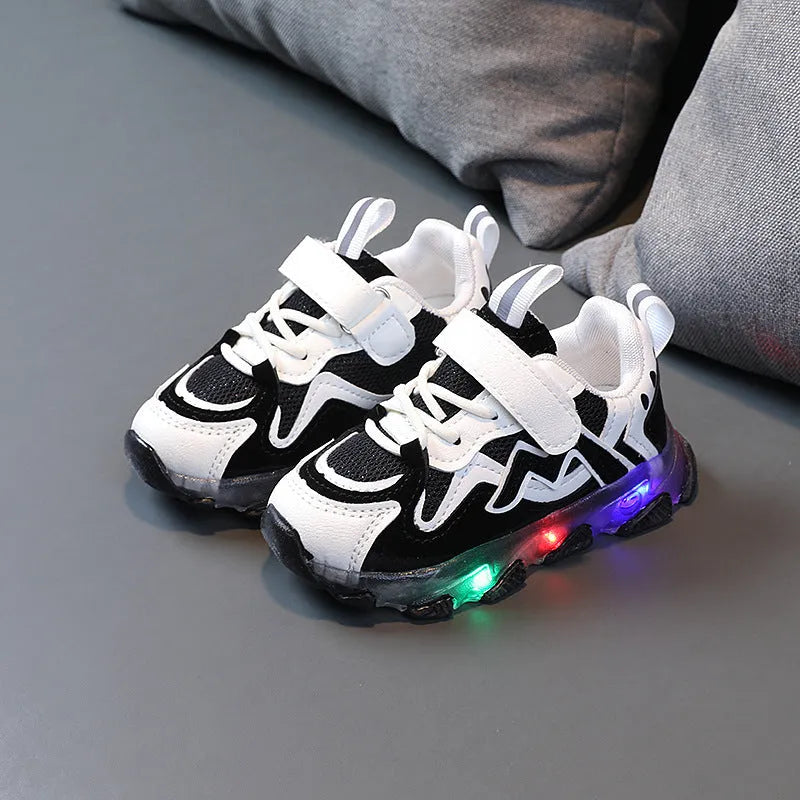 Children's breathable mesh Velcro sneakers in black, grey and pink colours showing rubber sole and adjustable fastening