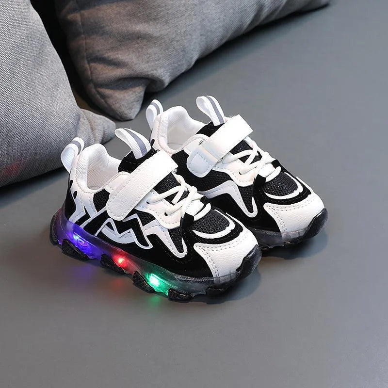 Children's breathable mesh Velcro sneakers in black, grey and pink colours showing rubber sole and adjustable fastening