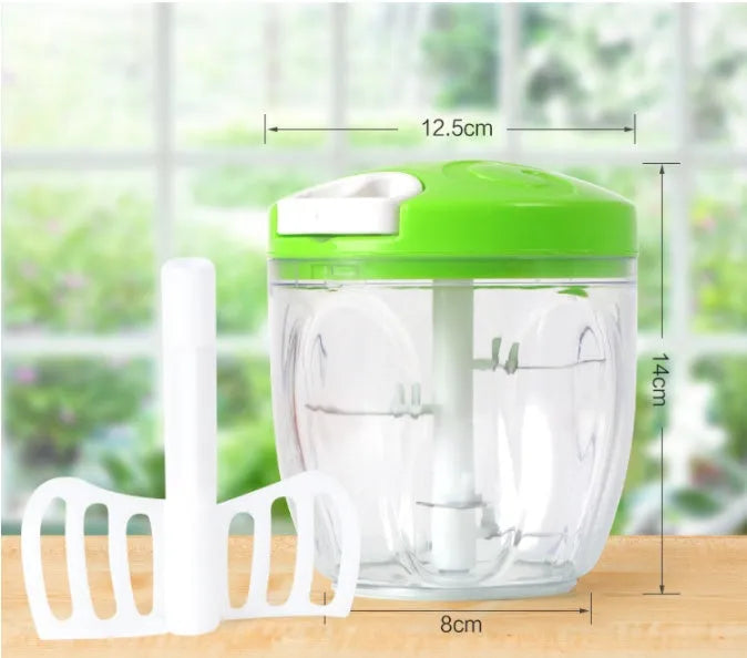 Green manual food chopper with lid open, showing three stainless steel blades inside a 500ml plastic container.