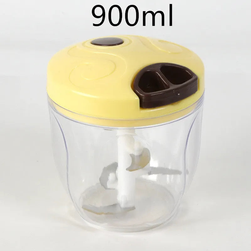Green manual food chopper with lid open, showing three stainless steel blades inside a 500ml plastic container.