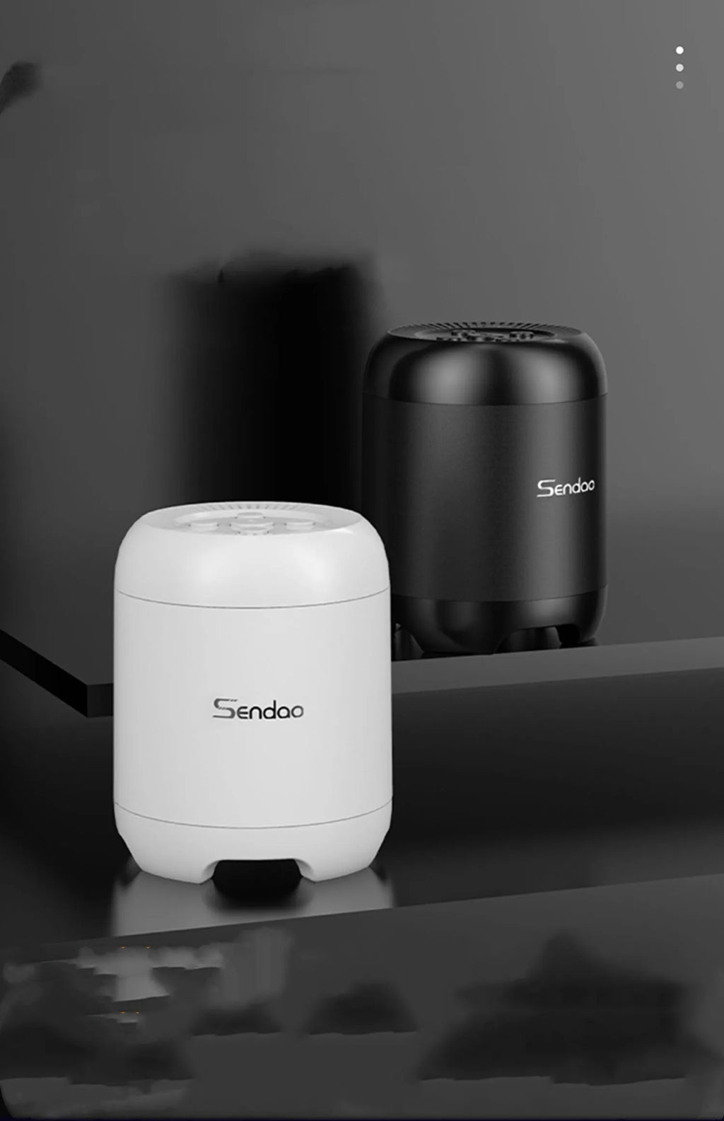Small black wireless Bluetooth speaker with card reader slot and USB port