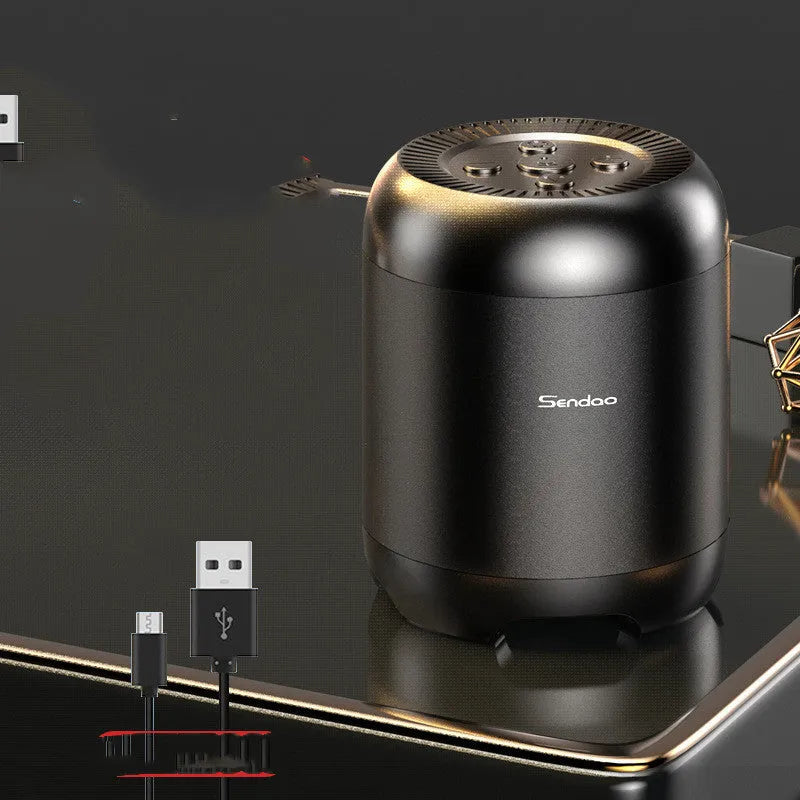 Small black wireless Bluetooth speaker with card reader slot and USB port