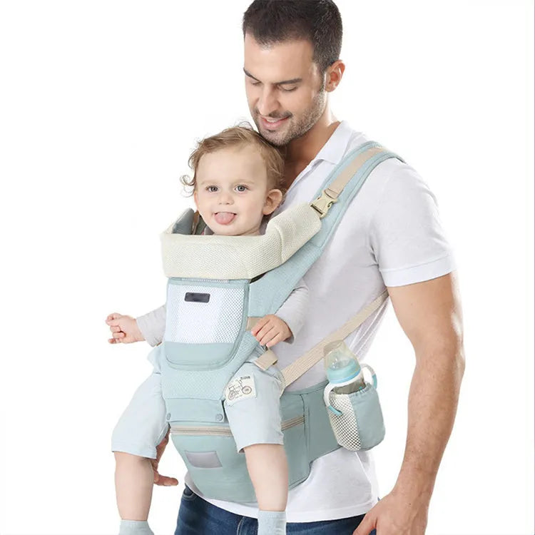 Four Seasons baby waist stool carrier in Ice Star Green cotton with shoulder straps and waist stool