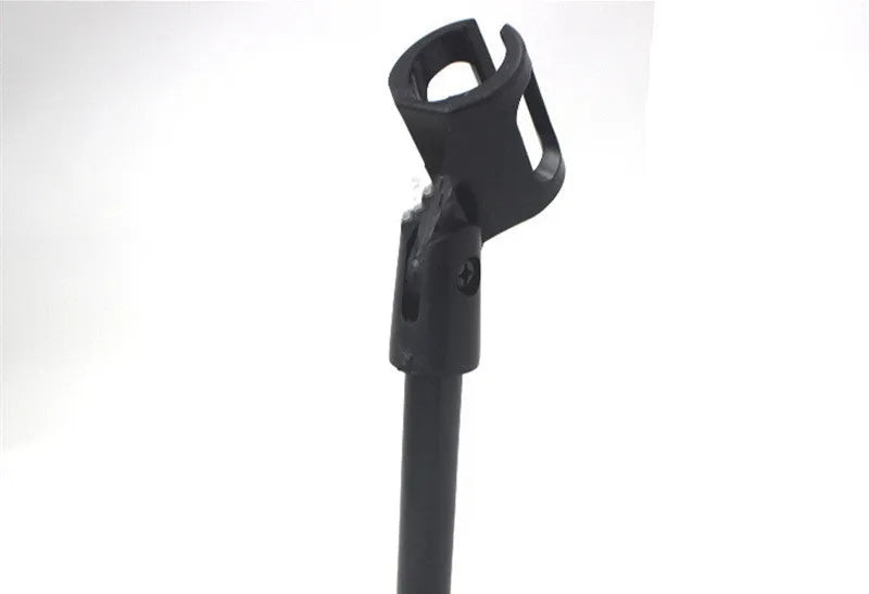 Black metal desktop microphone stand with disc base and plastic clip, 22cm tall.