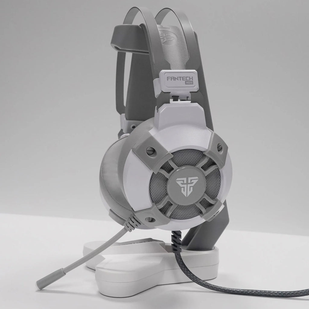 Black FANTECH HG11 USB gaming headset with RGB lights, large ear cups, and an adjustable microphone.