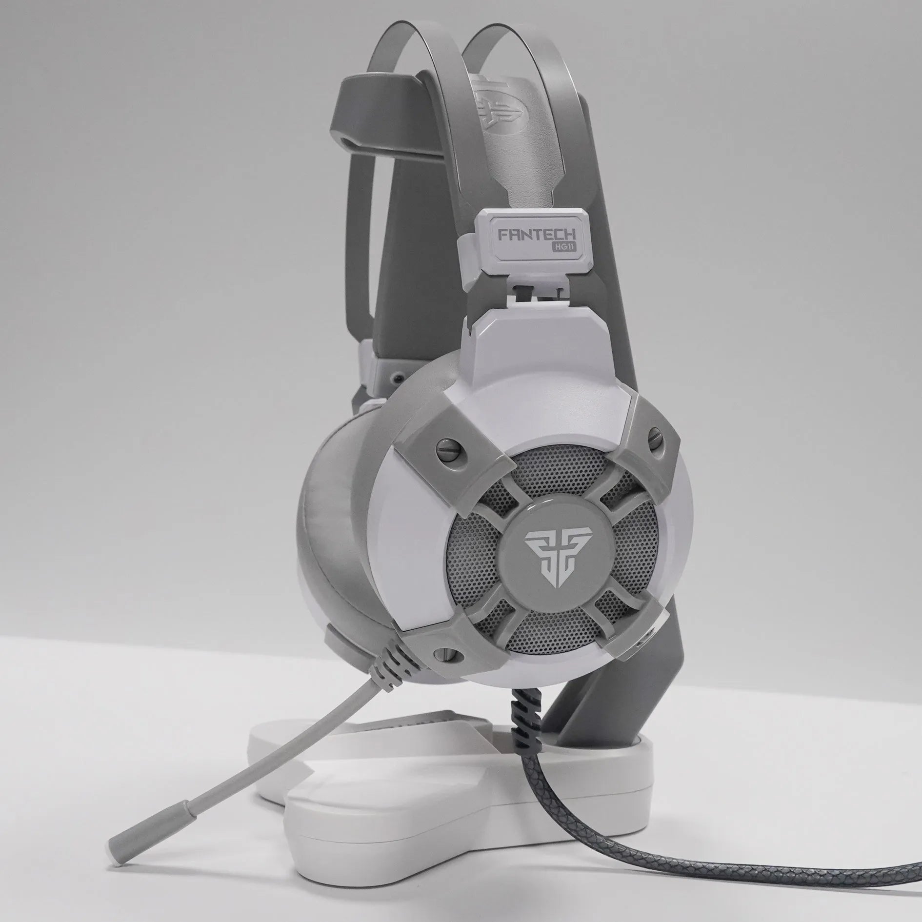 Black FANTECH HG11 USB gaming headset with RGB lights, large ear cups, and an adjustable microphone.