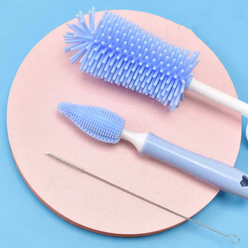 Silicone baby bottle brush and straw cleaner set in pink, blue, or yellow colours
