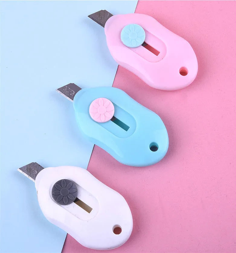 Cartoon-themed art knife showing one of five available style designs including Miffy and Robot.