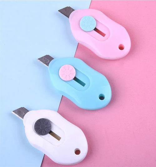 Cartoon-themed art knife showing one of five available style designs including Miffy and Robot.