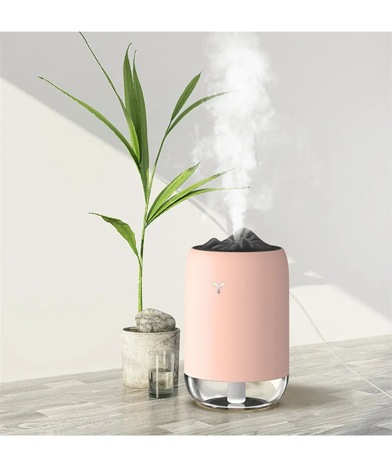 Magic Flame Humidifier columnar aroma diffuser with LED light effect in white, blue, or pink colours