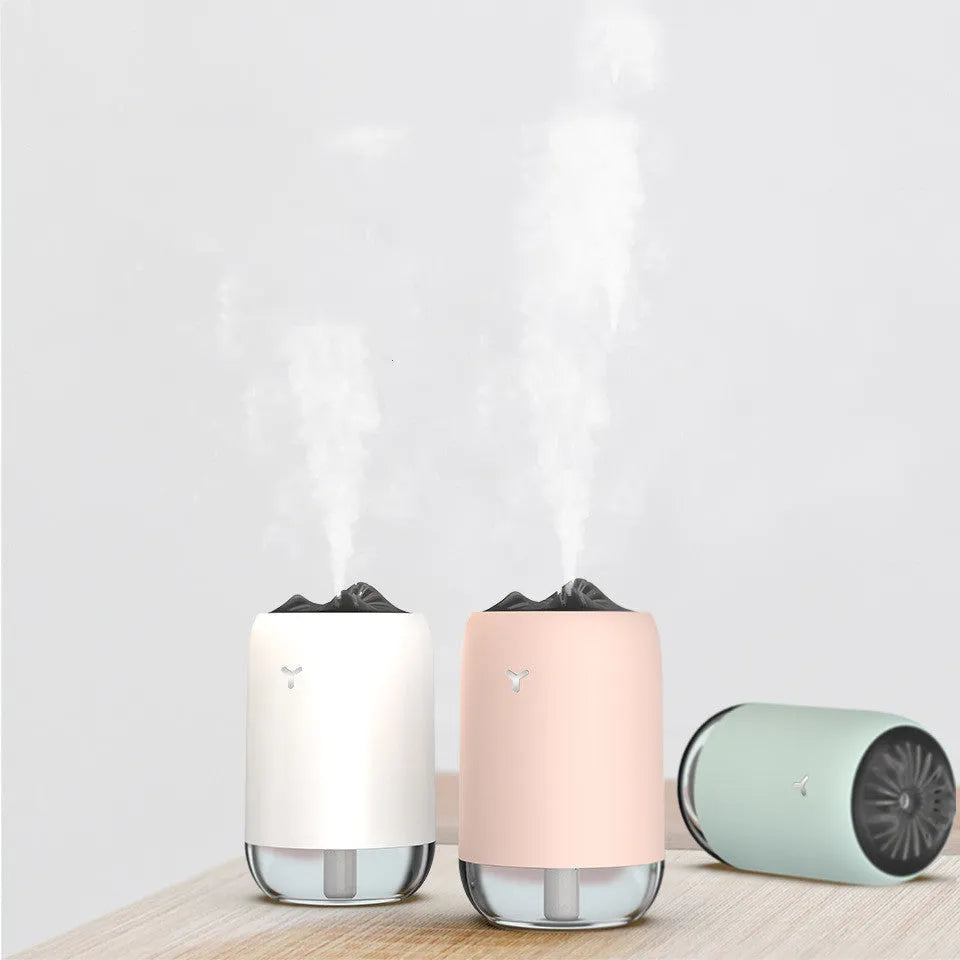 Magic Flame Humidifier columnar aroma diffuser with LED light effect in white, blue, or pink colours