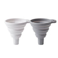 Silicone folding funnel in grey for pouring oil into a bottle in a modern kitchen