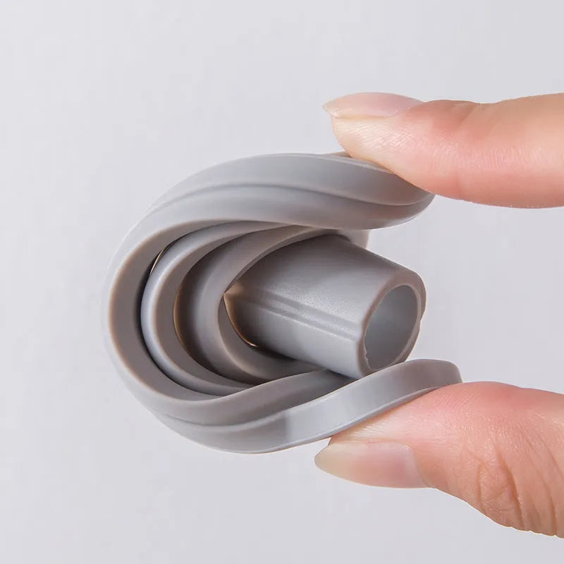 Silicone folding funnel in grey for pouring oil into a bottle in a modern kitchen