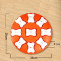Blue interactive dog puzzle toy with nine compartments and bone covers on a light background