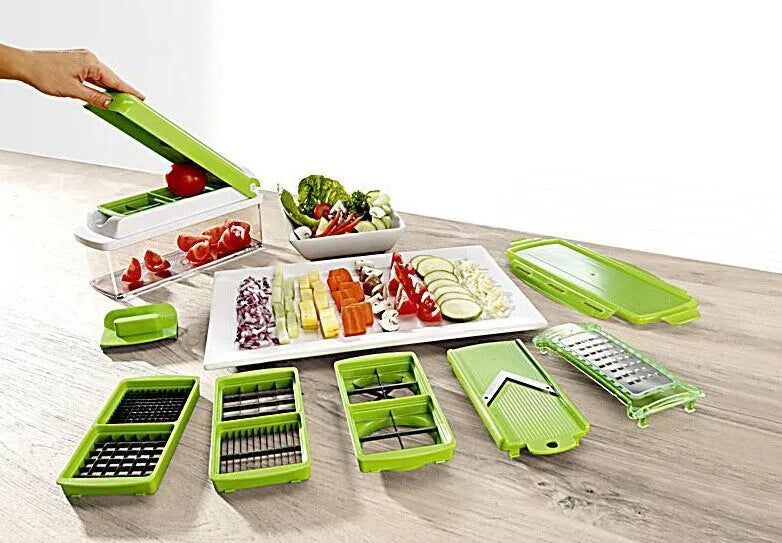 Green manual food chopper with stainless steel blades on a kitchen counter.