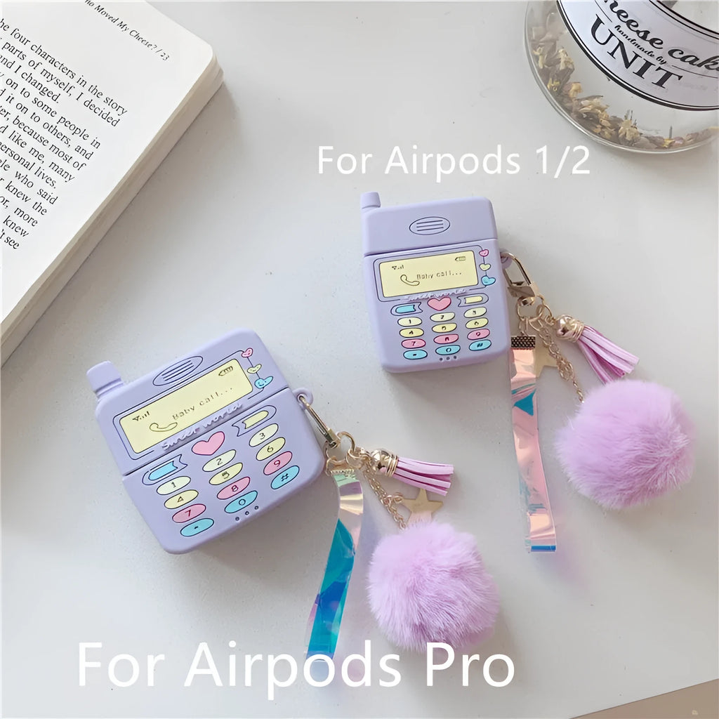 Purple silicone clamshell case for AirPods Pro or AirPods 1 and 2 with a matching fur ball pendant attached.