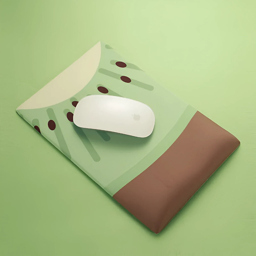 Green kiwi fruit design on a grey cloth wrist support mouse pad with thick silicone base.