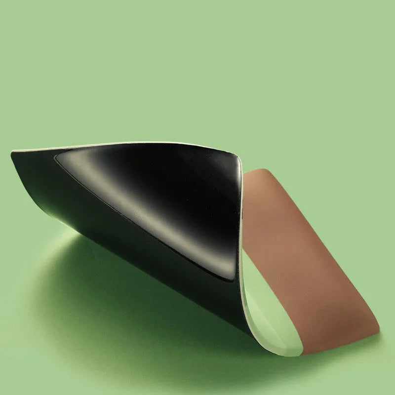 Green kiwi fruit design on a grey cloth wrist support mouse pad with thick silicone base.