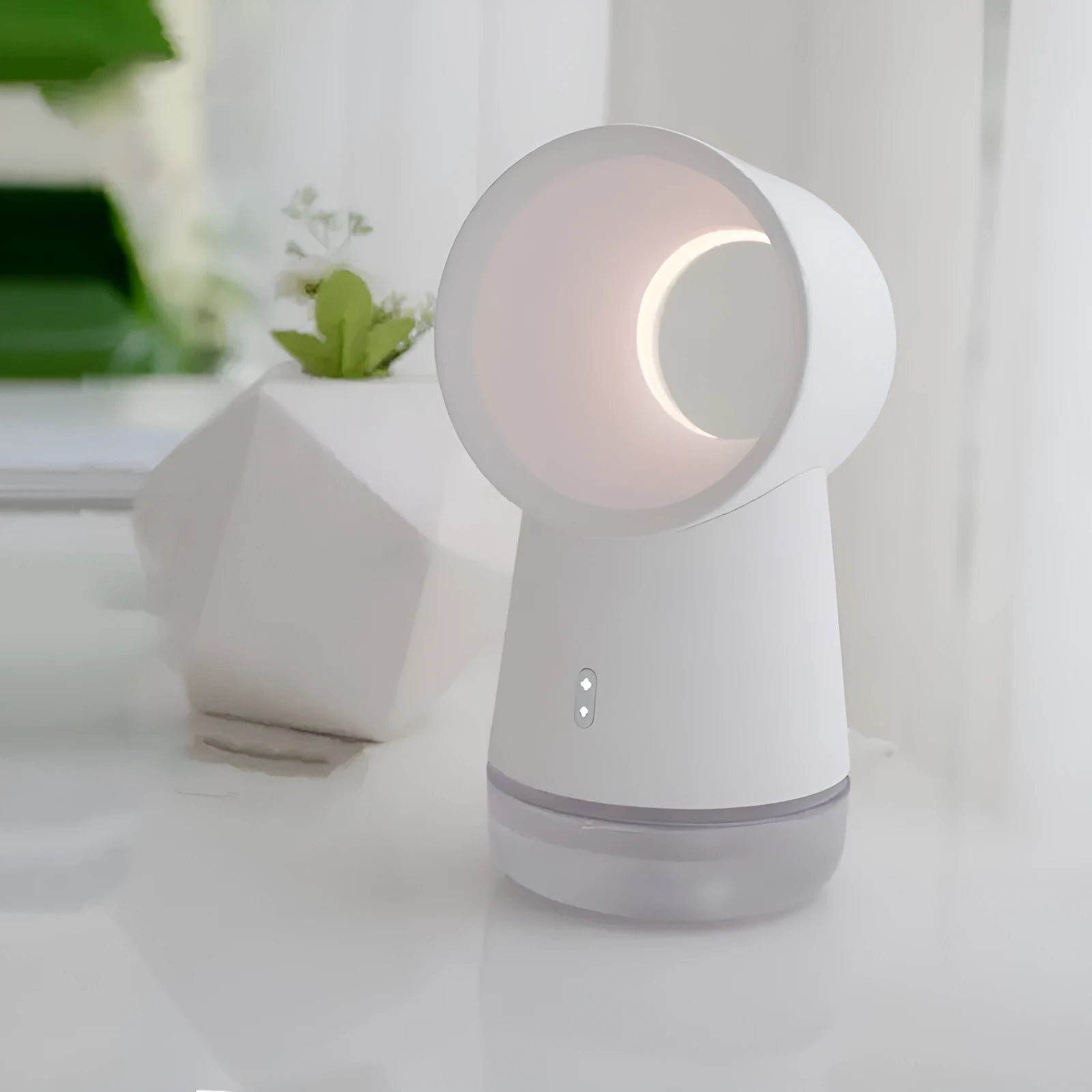 White desktop humidifier with leafless fan and night light on a wooden desk