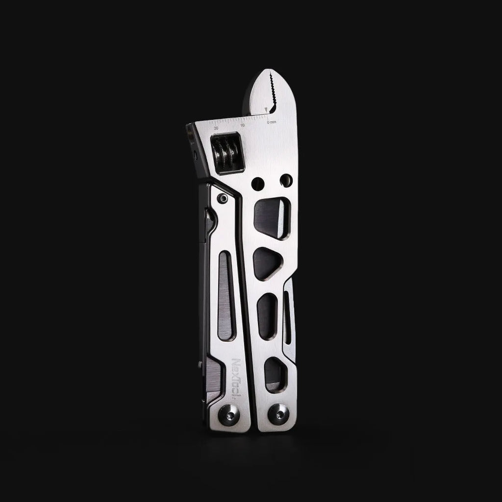 White stainless steel multi-function tool with wrench, knife, and needle-nose pliers