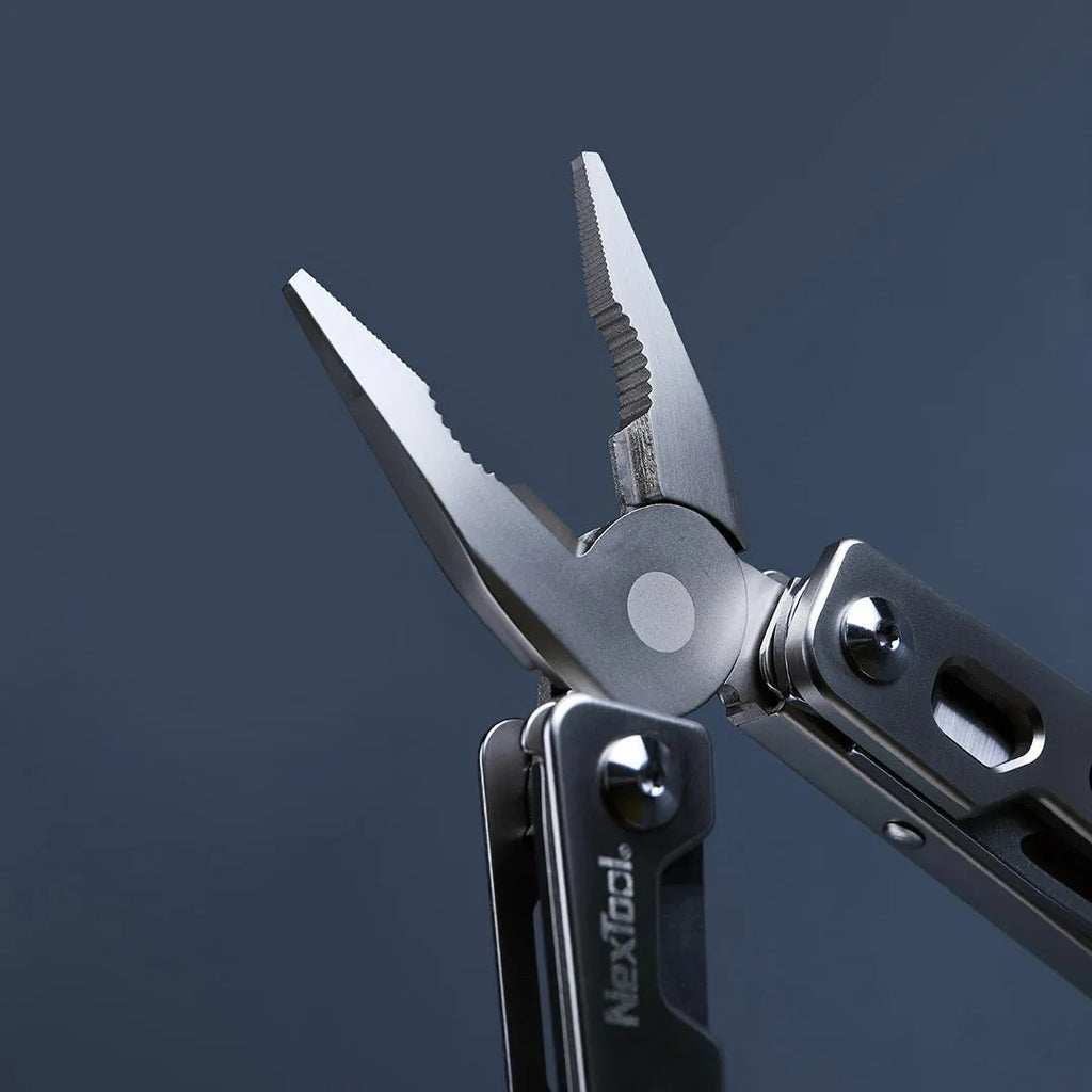 White stainless steel multi-function tool with wrench, knife, and needle-nose pliers