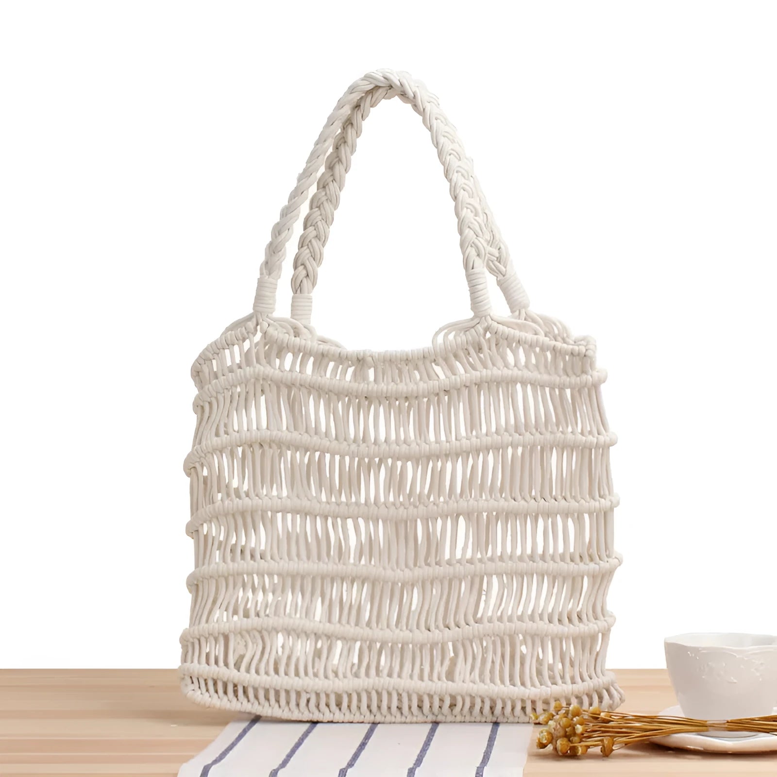 Medium woven straw beach bag with open top and double soft handles in white, black, and camel colours