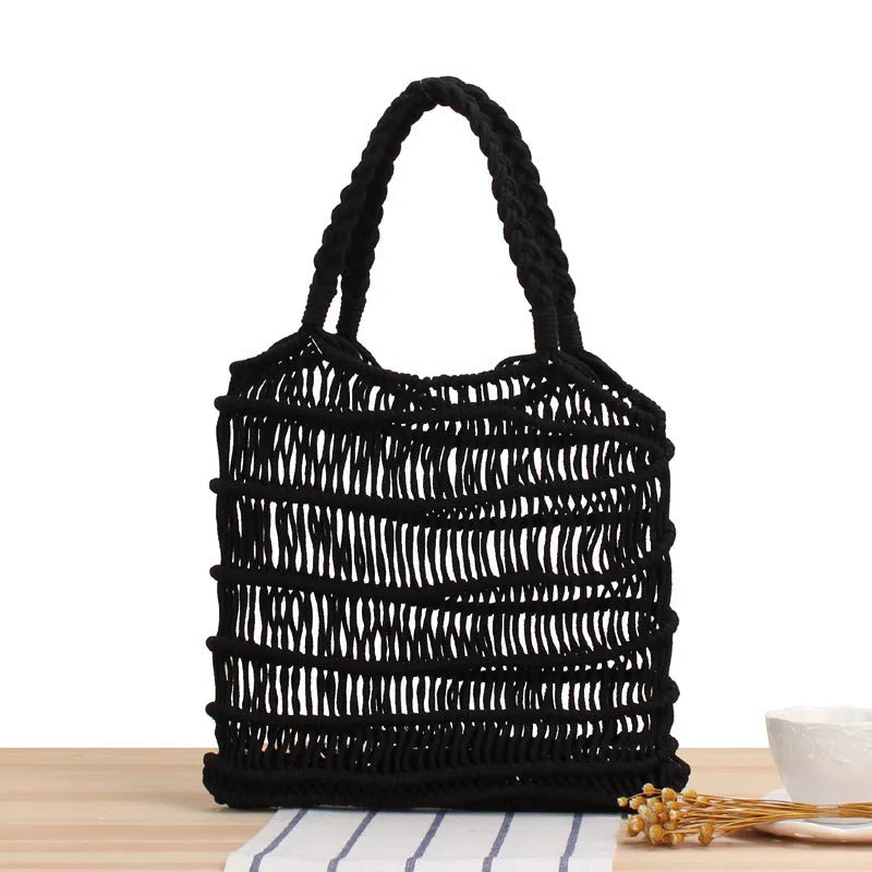 Medium woven straw beach bag with open top and double soft handles in white, black, and camel colours