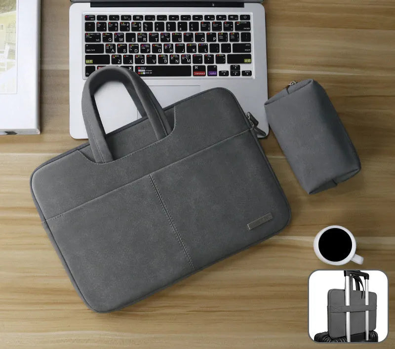 Blue PU leather laptop bag with zipper open, showing internal shock-resistant liner and multiple organisation pockets.