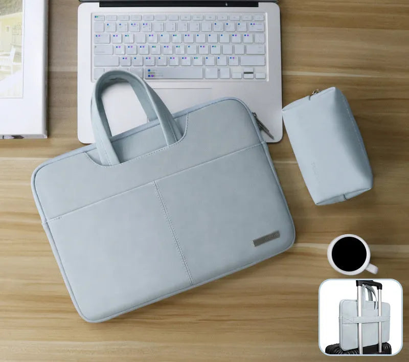 Blue PU leather laptop bag with zipper open, showing internal shock-resistant liner and multiple organisation pockets.