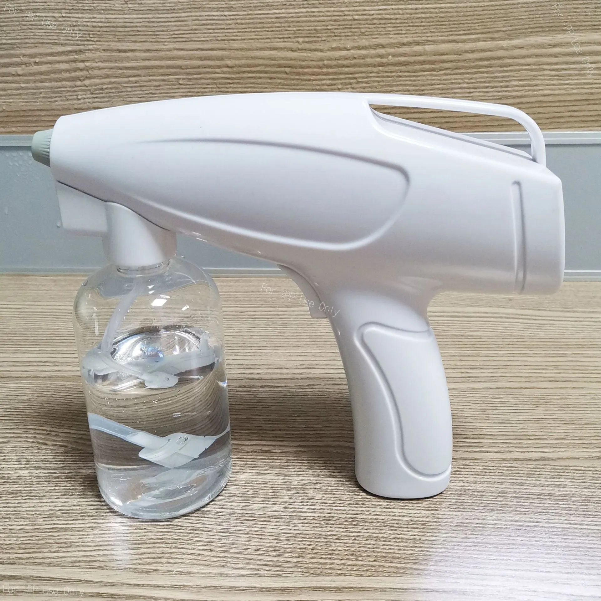 White handheld wireless electric disinfection spray gun with USB-C charging port.