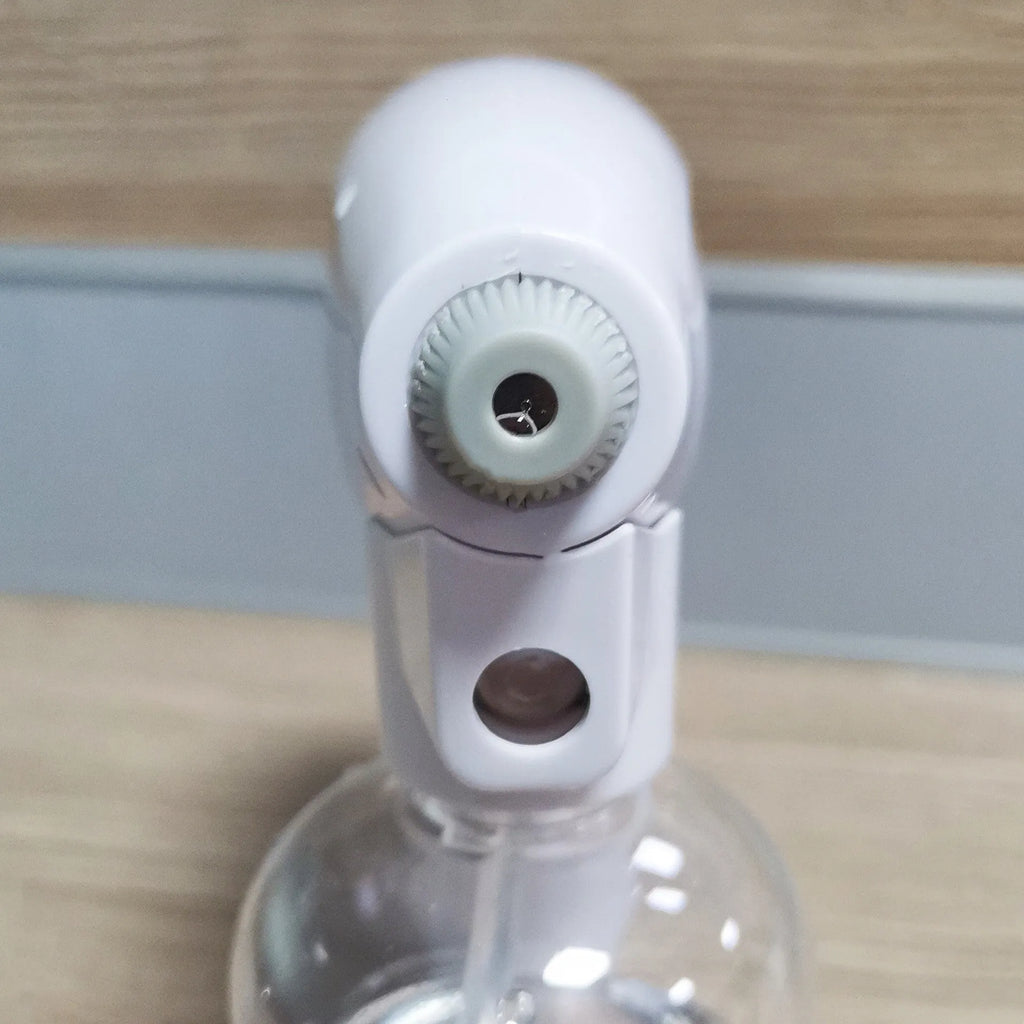 White handheld wireless electric disinfection spray gun with USB-C charging port.