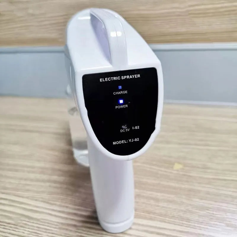 White handheld wireless electric disinfection spray gun with USB-C charging port.