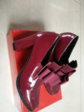 Women's black patent leather high heels with thick heel and square toe design