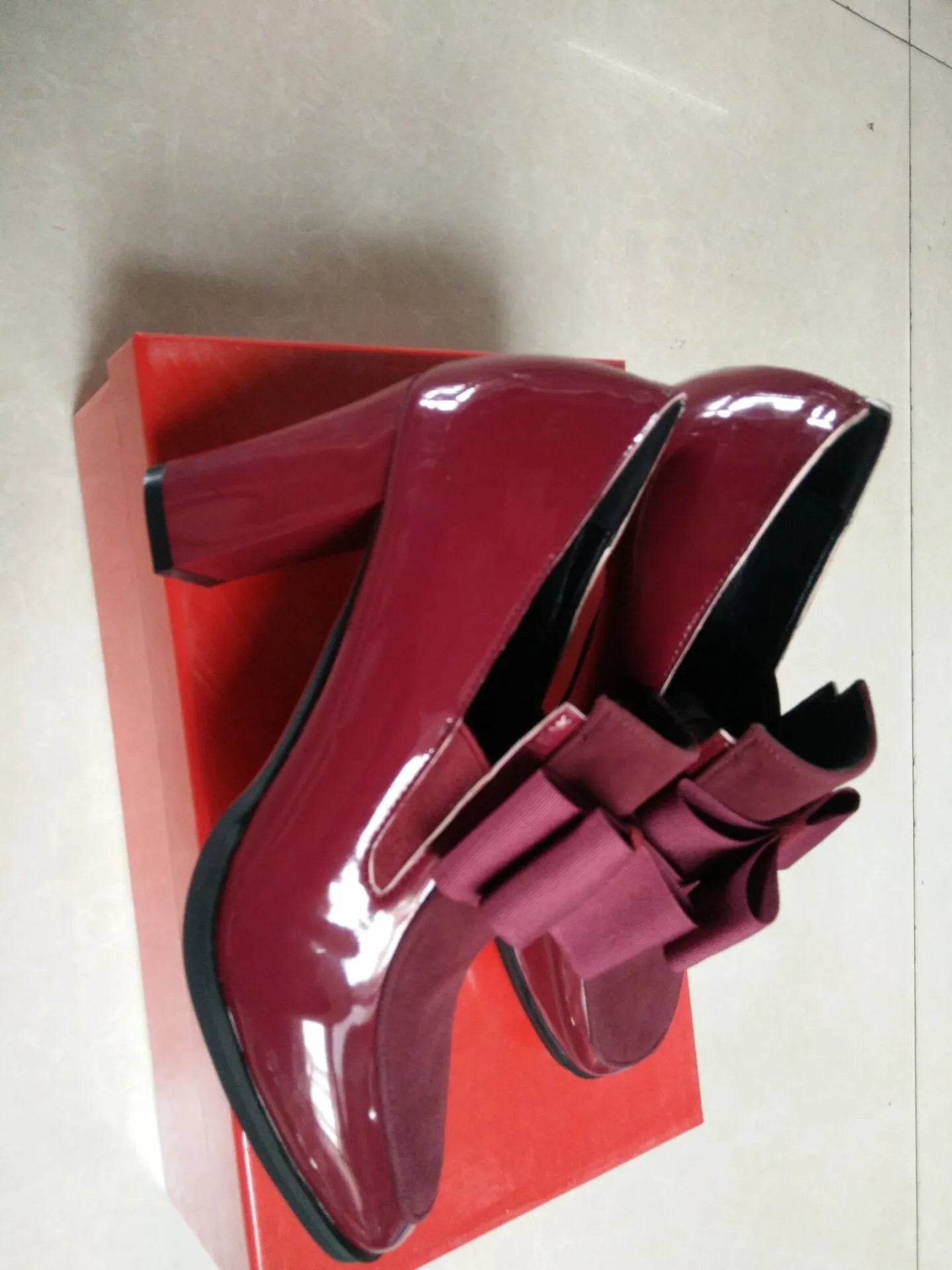 Women's black patent leather high heels with thick heel and square toe design