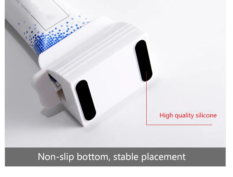 Large toothpaste squeezer in white ABS plastic with a toothpaste tube inserted