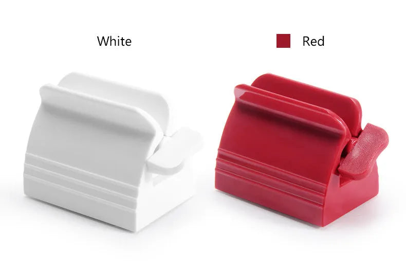 Large toothpaste squeezer in white ABS plastic with a toothpaste tube inserted
