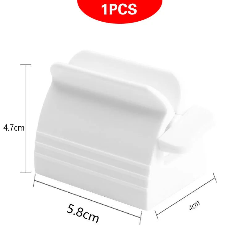 Large toothpaste squeezer in white ABS plastic with a toothpaste tube inserted