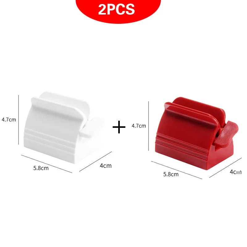 Large toothpaste squeezer in white ABS plastic with a toothpaste tube inserted