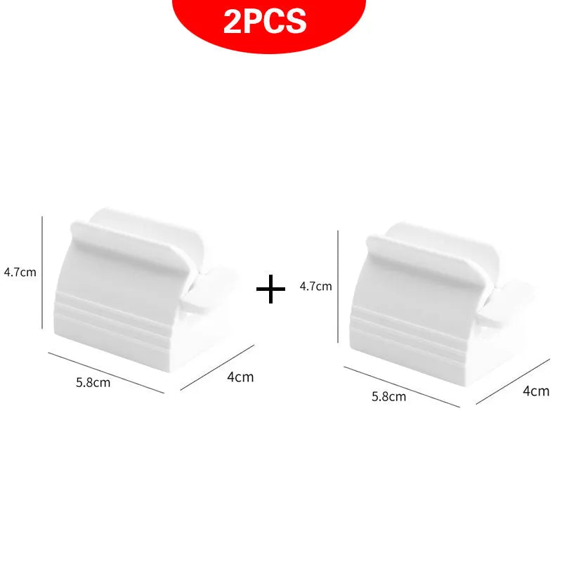 Large toothpaste squeezer in white ABS plastic with a toothpaste tube inserted
