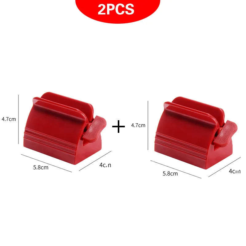 Large toothpaste squeezer in white ABS plastic with a toothpaste tube inserted