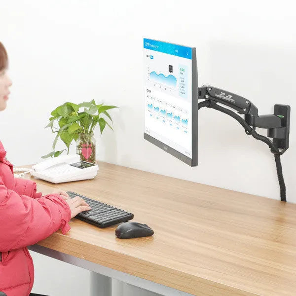 Black wall-mounted telescopic monitor arm holding a screen, showing rotation and extension.