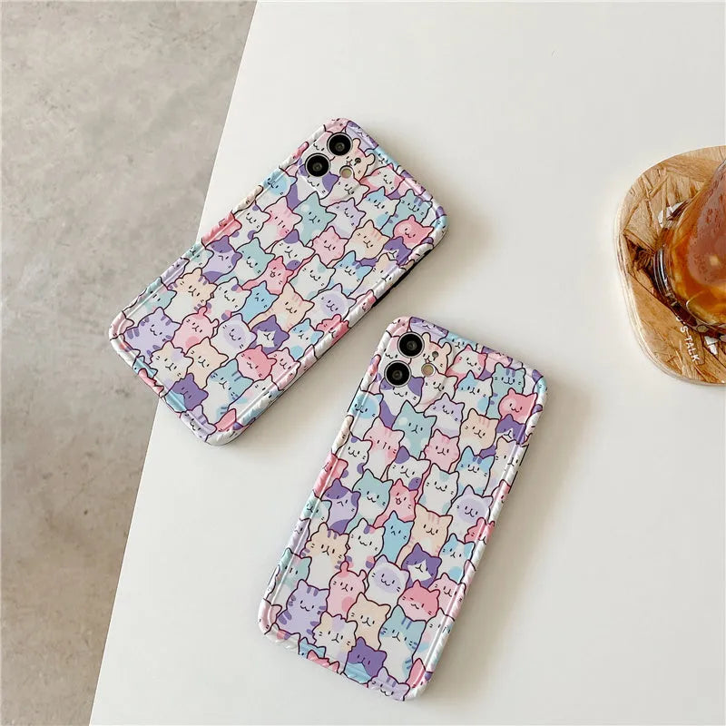 Clear TPU iPhone case with colourful cartoon design, shown fitted on an iPhone.