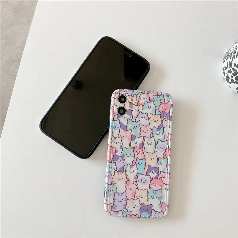 Clear TPU iPhone case with colourful cartoon design, shown fitted on an iPhone.