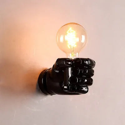 Creative resin fist sculpture wall lamp in black, white, or wood grain finish for left or right hand mounting.