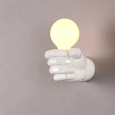Creative resin fist sculpture wall lamp in black, white, or wood grain finish for left or right hand mounting.