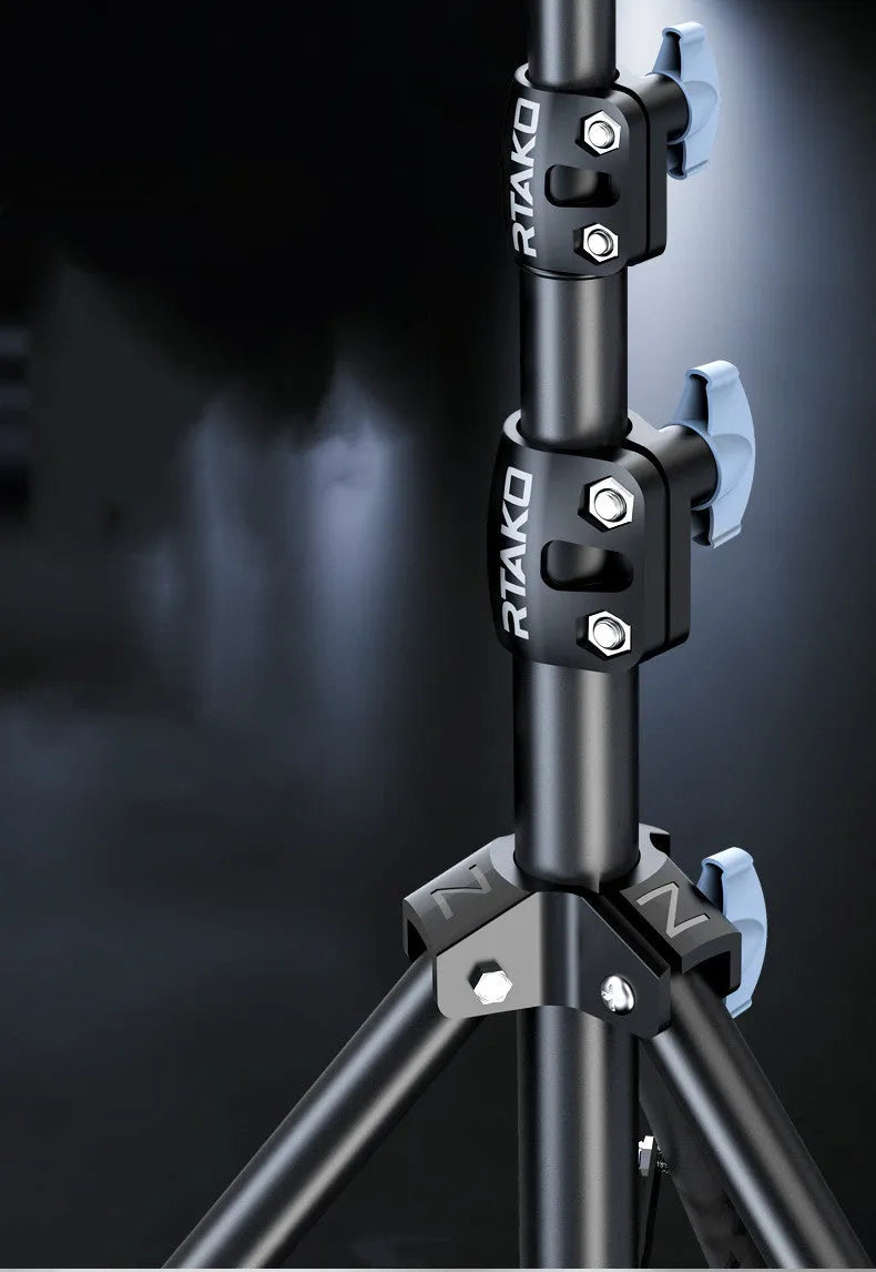 Carbon alloy steel phone tripod with a ring light, shown extended to its full height.