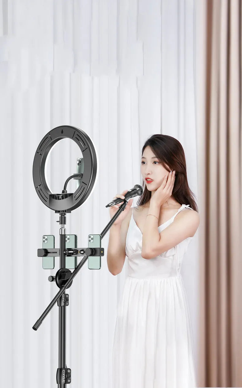 Carbon alloy steel phone tripod with a ring light, shown extended to its full height.
