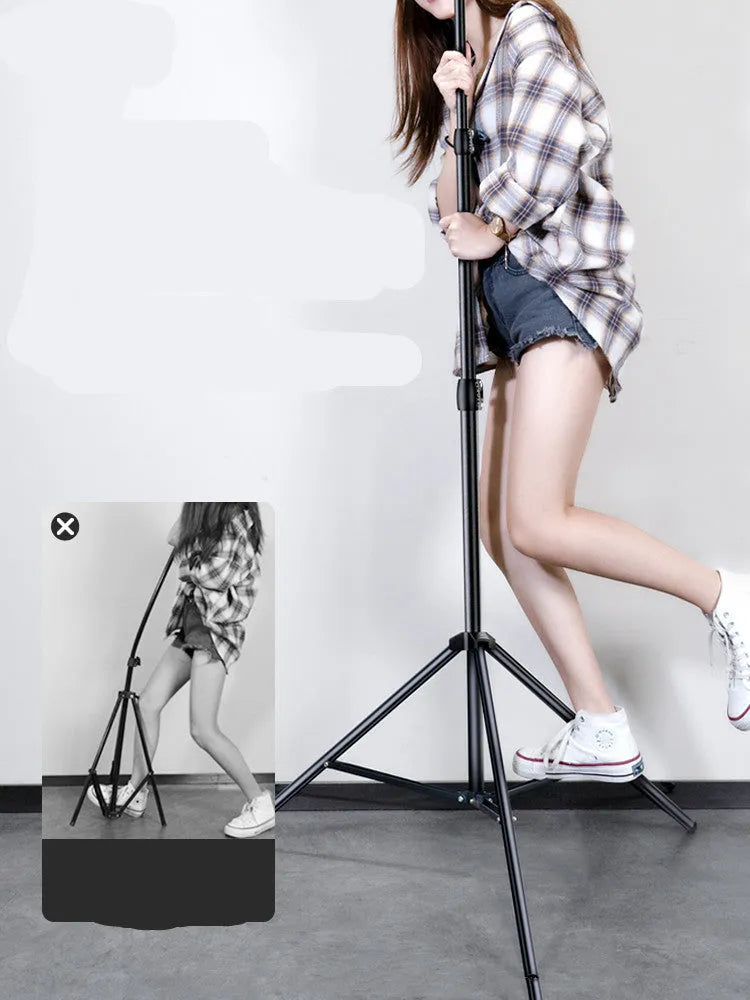 Carbon alloy steel phone tripod with a ring light, shown extended to its full height.