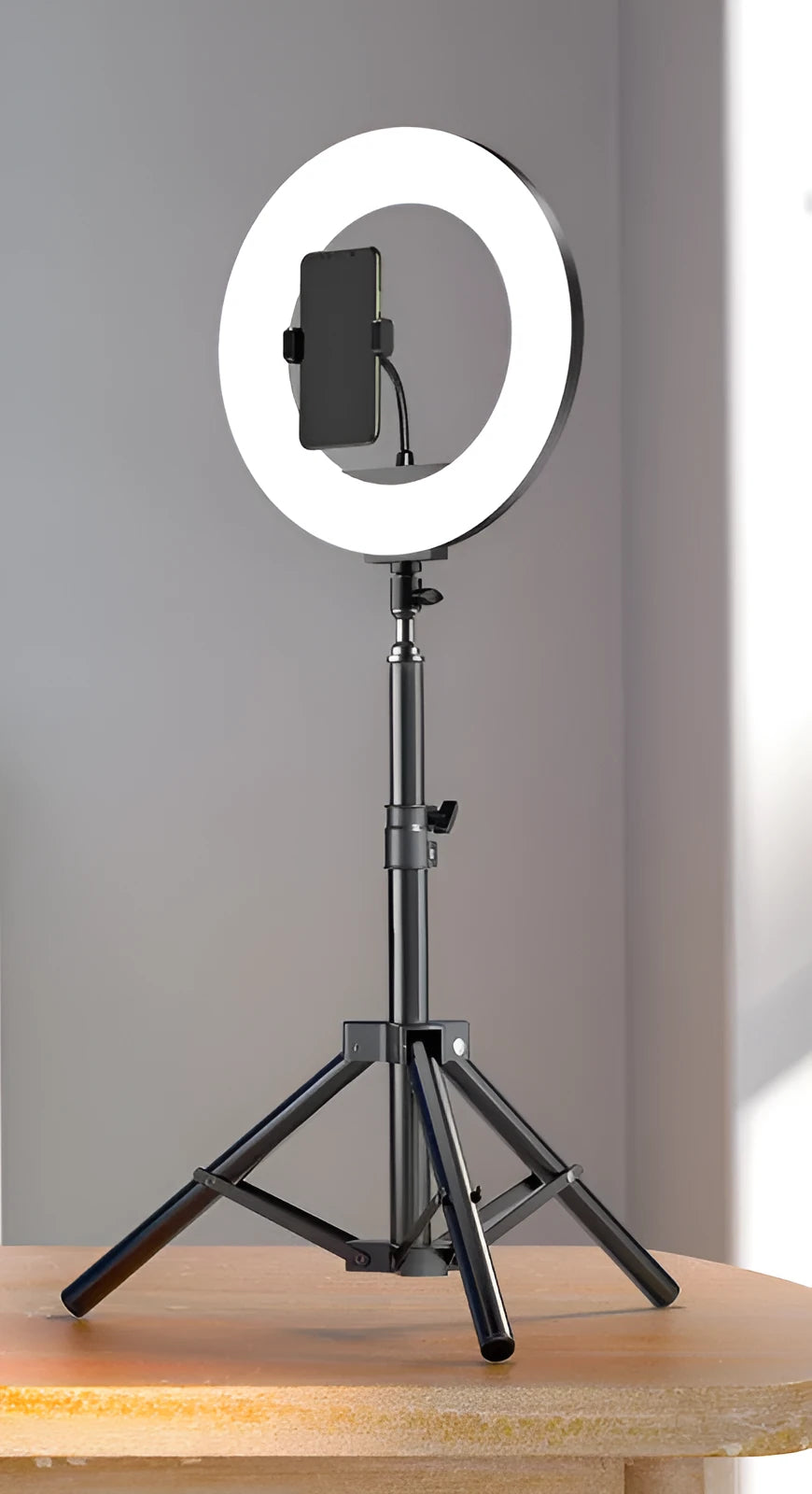 Carbon alloy steel phone tripod with a ring light, shown extended to its full height.