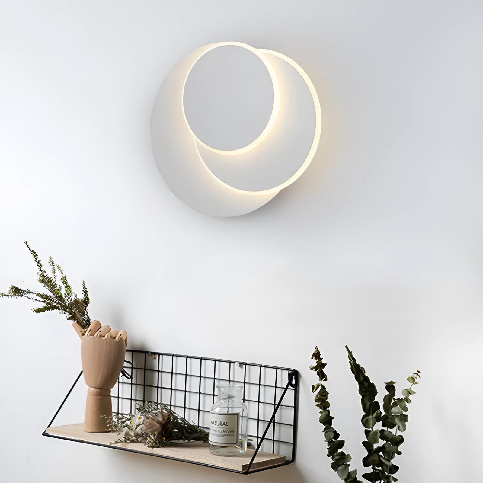 Round acrylic LED wall lamp in black or white with push button switch